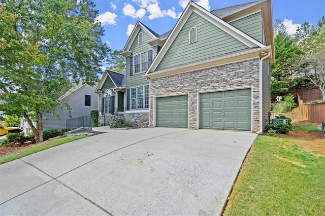 view of front of home featuring a front yard and a garage