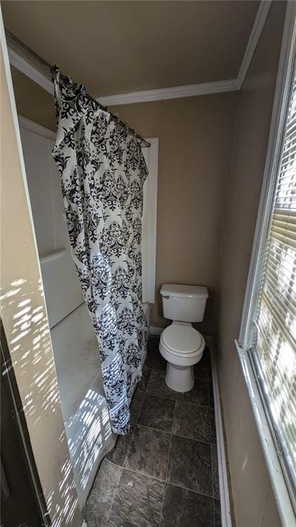 bathroom featuring toilet and ornamental molding