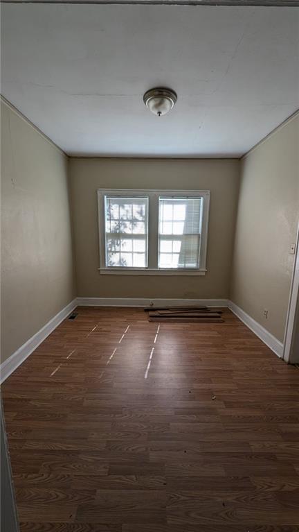 empty room featuring dark hardwood / wood-style floors