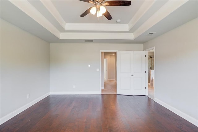 2378 Morgan Creek Rd, Buford, GA 30519 - unfurnished bedroom featuring a raised ceiling, dark wood-style flooring, ornamental molding, and a ceiling fan