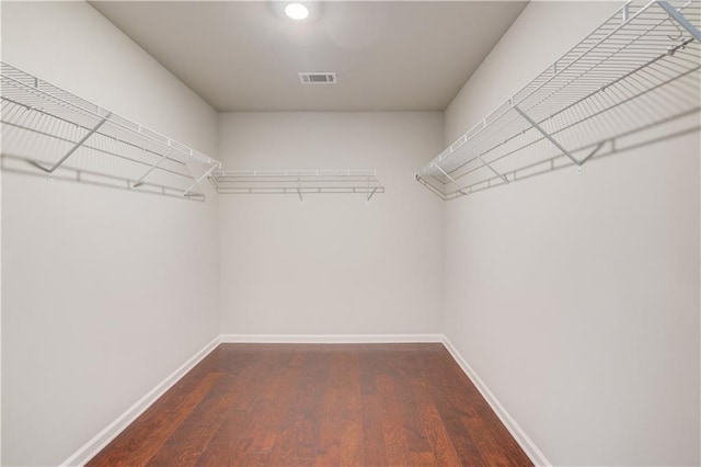 2378 Morgan Creek Rd, Buford, GA 30519 - walk in closet with dark wood-type flooring