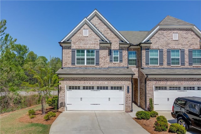 2378 Morgan Creek Rd, Buford, GA 30519 - view of front facade with a garage, brick siding, and driveway