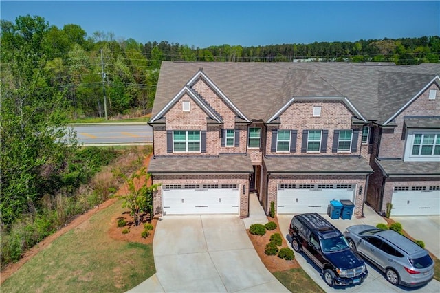 2378 Morgan Creek Rd, Buford, GA 30519 - view of front of property featuring concrete driveway, an attached garage, and brick siding