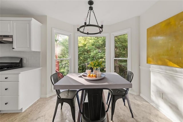 179 Hunters Crk, Dallas, GA 30157 - dining area featuring a chandelier and healthy amount of natural light