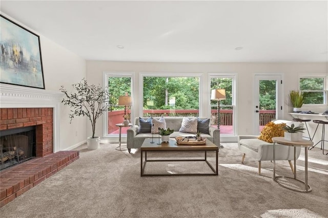 179 Hunters Crk, Dallas, GA 30157 - carpeted living area featuring a brick fireplace and baseboards