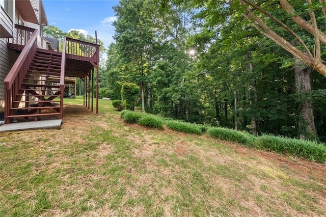 179 Hunters Crk, Dallas, GA 30157 - view of green lawn with stairway and a wooden deck