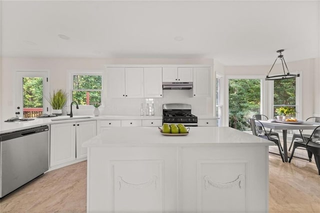 179 Hunters Crk, Dallas, GA 30157 - kitchen featuring stainless steel appliances, under cabinet range hood, light countertops, and white cabinets