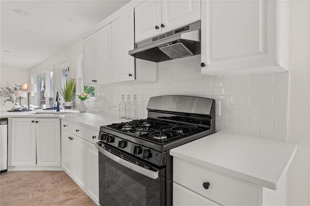 179 Hunters Crk, Dallas, GA 30157 - kitchen featuring range with gas stovetop, under cabinet range hood, backsplash, white cabinets, and light countertops