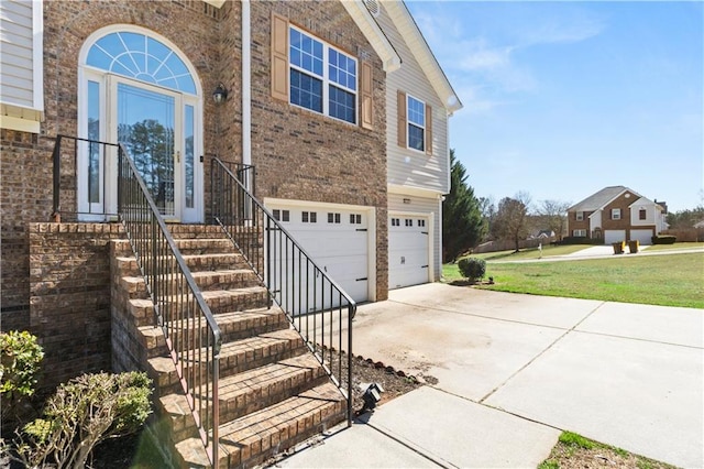 view of front of home featuring a garage and a front yard