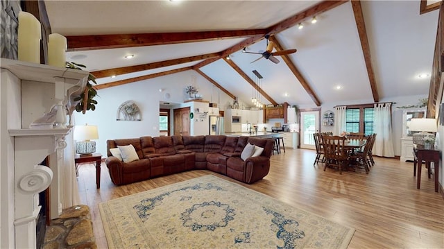 living room with light wood-style floors, ceiling fan, high vaulted ceiling, and beamed ceiling