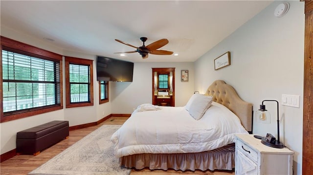 bedroom with ceiling fan, recessed lighting, light wood-style flooring, and baseboards