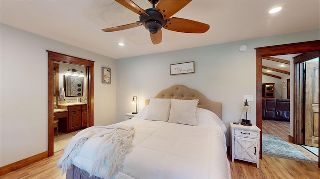 bedroom with ensuite bathroom, recessed lighting, a ceiling fan, baseboards, and light wood-type flooring