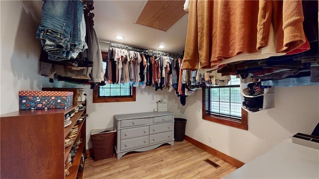 walk in closet with light wood-type flooring and visible vents