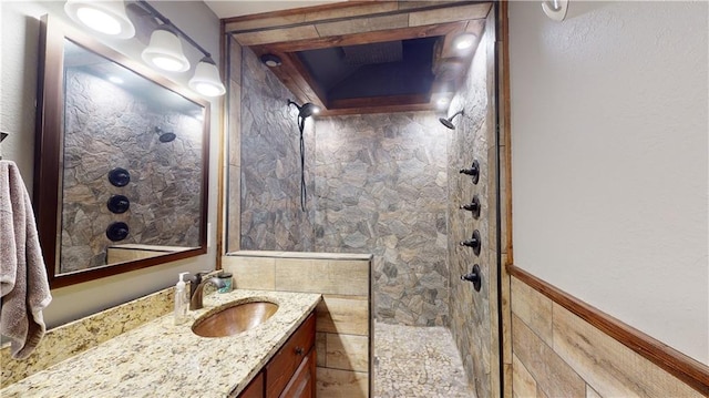 full bath featuring walk in shower and vanity