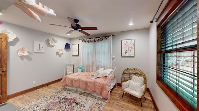 bedroom with recessed lighting, ceiling fan, baseboards, and wood finished floors