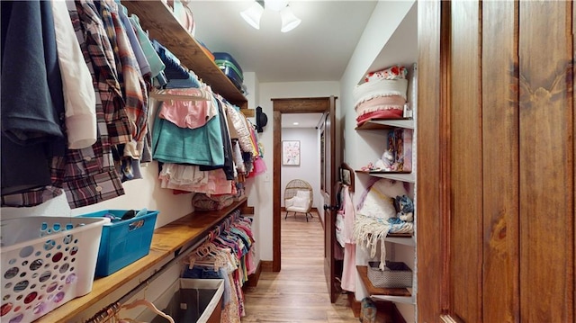 spacious closet featuring wood finished floors