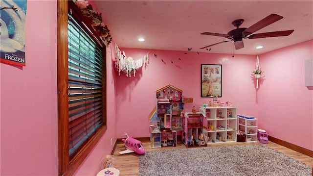 rec room featuring ceiling fan, baseboards, wood finished floors, and recessed lighting