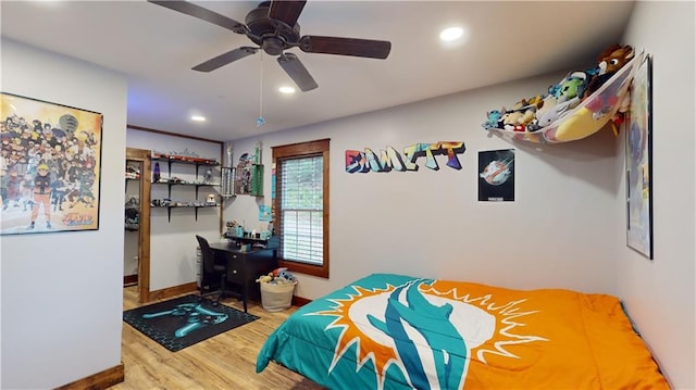 bedroom featuring baseboards, wood finished floors, a ceiling fan, and recessed lighting