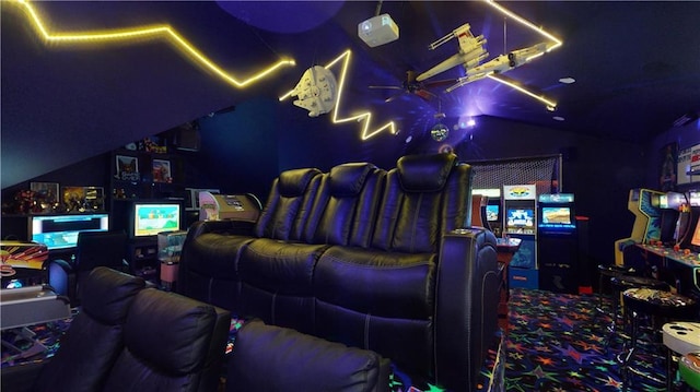 home theater featuring lofted ceiling, carpet floors, and ceiling fan