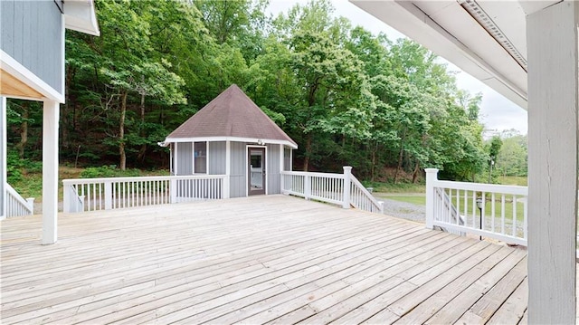 wooden deck with an outbuilding