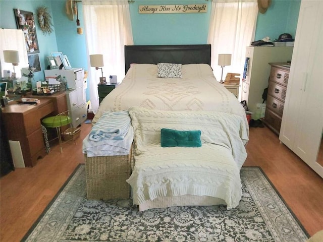 bedroom with wood finished floors