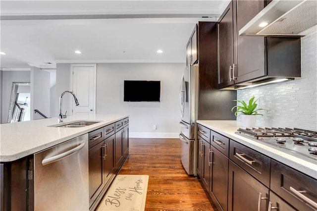 4550 Lois St SE, Smyrna, GA 30080 - kitchen featuring a sink, appliances with stainless steel finishes, under cabinet range hood, crown molding, and tasteful backsplash