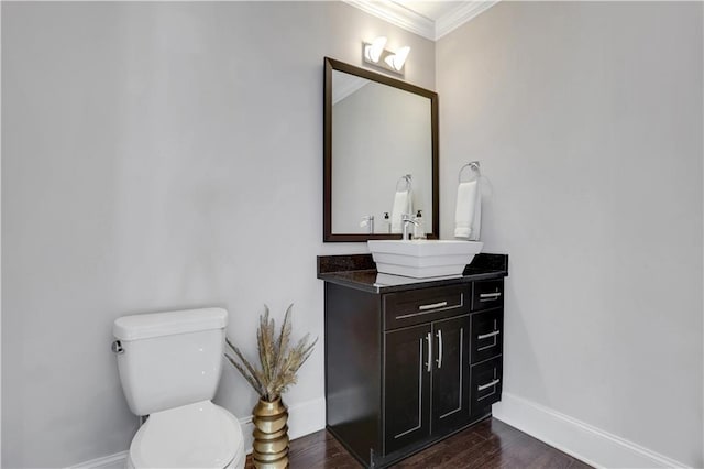 4550 Lois St SE, Smyrna, GA 30080 - bathroom featuring vanity, crown molding, baseboards, toilet, and wood finished floors