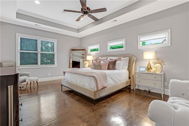 4550 Lois St SE, Smyrna, GA 30080 - bedroom featuring baseboards, a tray ceiling, wood finished floors, recessed lighting, and ornamental molding