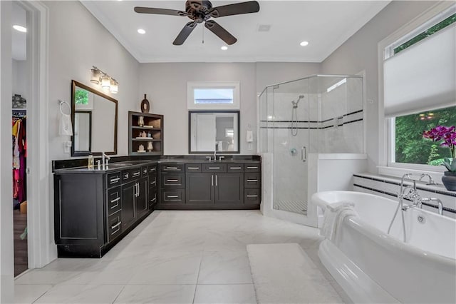 4550 Lois St SE, Smyrna, GA 30080 - bathroom with a soaking tub, a stall shower, vanity, a ceiling fan, and marble look tiles