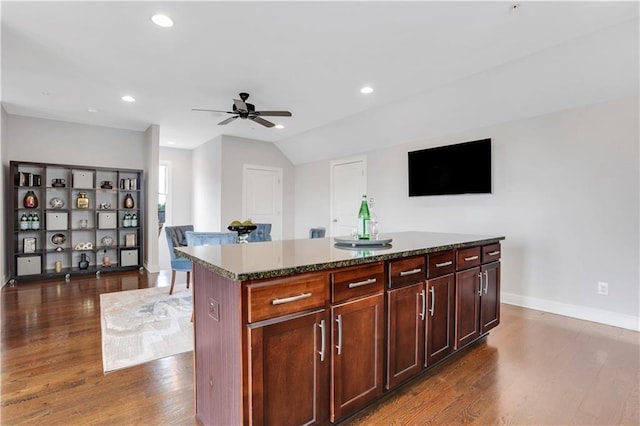 4550 Lois St SE, Smyrna, GA 30080 - kitchen with dark wood-type flooring, ceiling fan, dark stone counters, baseboards, and recessed lighting