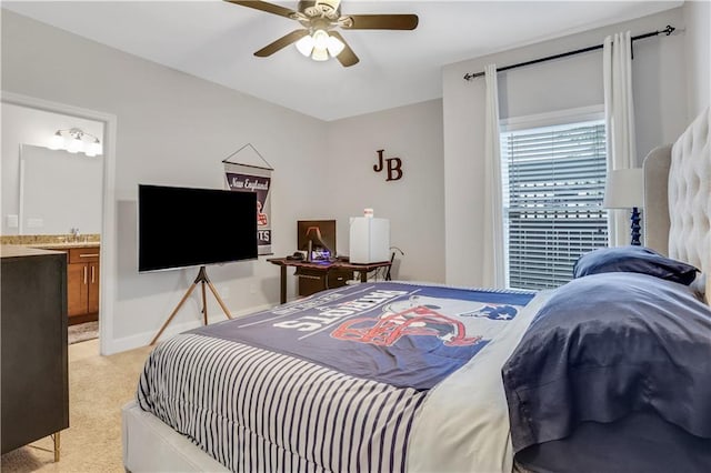 4550 Lois St SE, Smyrna, GA 30080 - bedroom with light carpet, a ceiling fan, baseboards, and ensuite bath