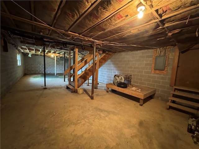 below grade area featuring stairway and electric panel