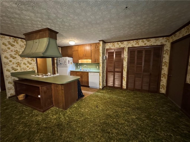 kitchen featuring white appliances, exhaust hood, wallpapered walls, and brown cabinets