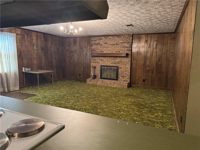 below grade area with visible vents, wooden walls, and a fireplace