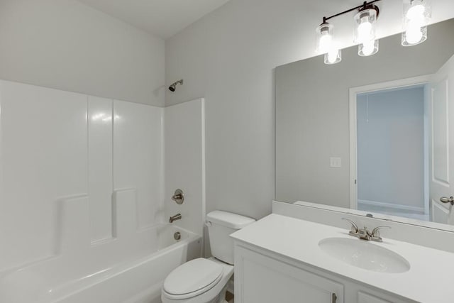 full bath featuring bathtub / shower combination, vanity, and toilet