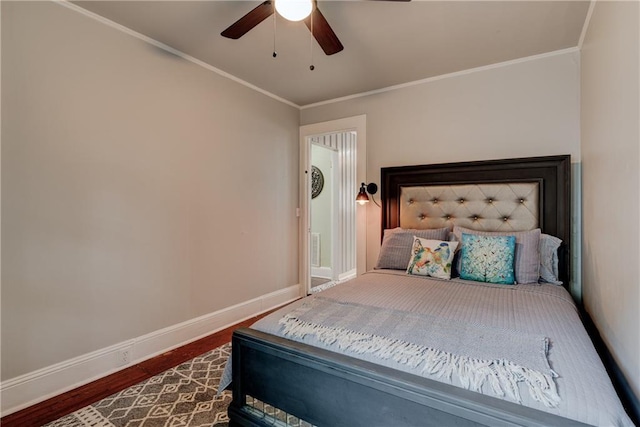 bedroom featuring hardwood / wood-style floors, ceiling fan, and crown molding