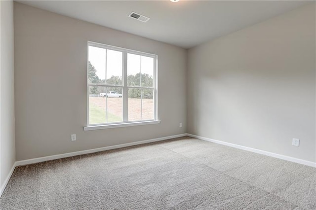 empty room with light colored carpet