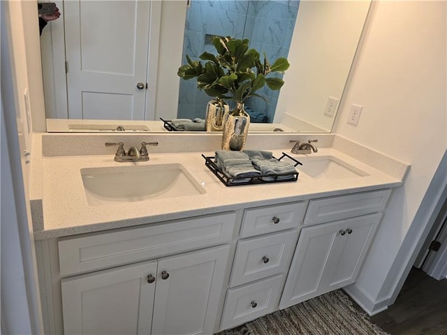 bathroom featuring hardwood / wood-style flooring and vanity