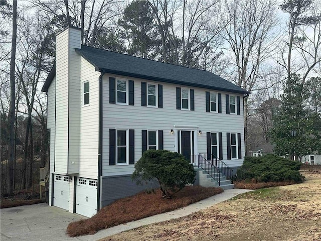 colonial house featuring a garage