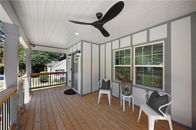 deck with a porch and ceiling fan