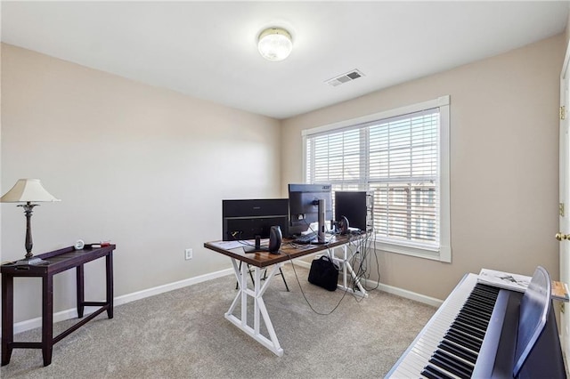 carpeted home office featuring baseboards and visible vents