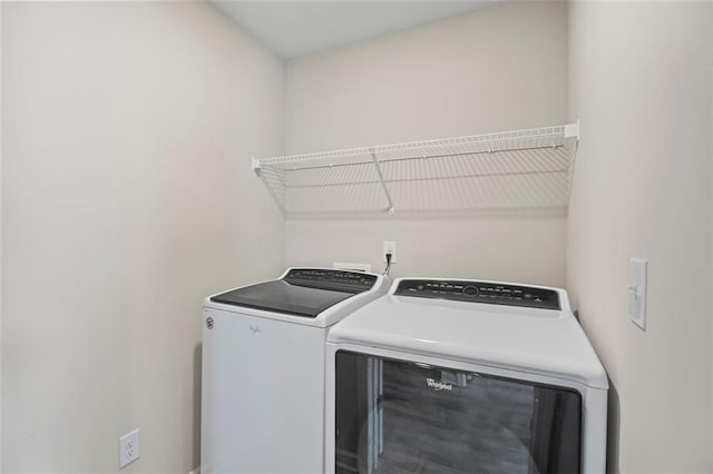 165 Twin Lakes Dr, Covington, GA 30016 - clothes washing area with washer and clothes dryer and laundry area