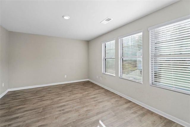 165 Twin Lakes Dr, Covington, GA 30016 - unfurnished room with baseboards, light wood-style floors, and visible vents
