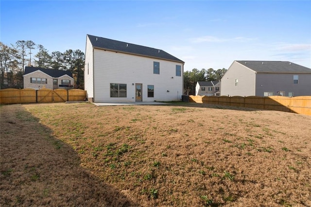 165 Twin Lakes Dr, Covington, GA 30016 - rear view of property featuring a fenced backyard, a yard, and a patio area