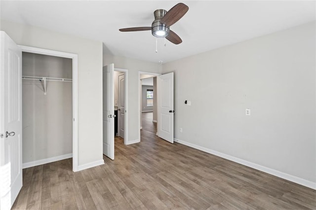 165 Twin Lakes Dr, Covington, GA 30016 - unfurnished bedroom featuring light wood-style flooring, a closet, and baseboards