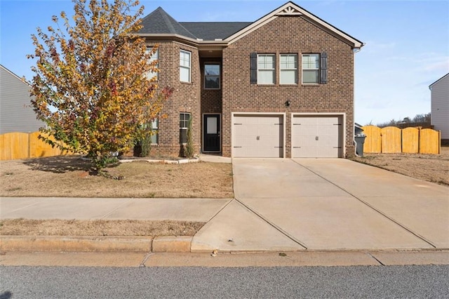 165 Twin Lakes Dr, Covington, GA 30016 - view of front of home featuring brick siding, driveway, fence, and a garage