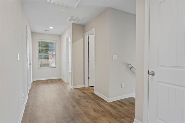 165 Twin Lakes Dr, Covington, GA 30016 - corridor featuring attic access, wood finished floors, visible vents, and baseboards