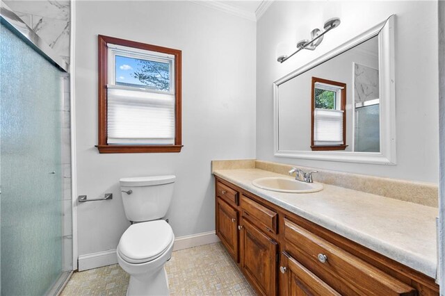 spare room with a tray ceiling, ornamental molding, and light wood finished floors