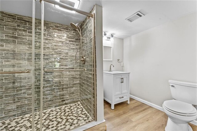 interior space with recessed lighting, baseboards, wood finished floors, and electric panel