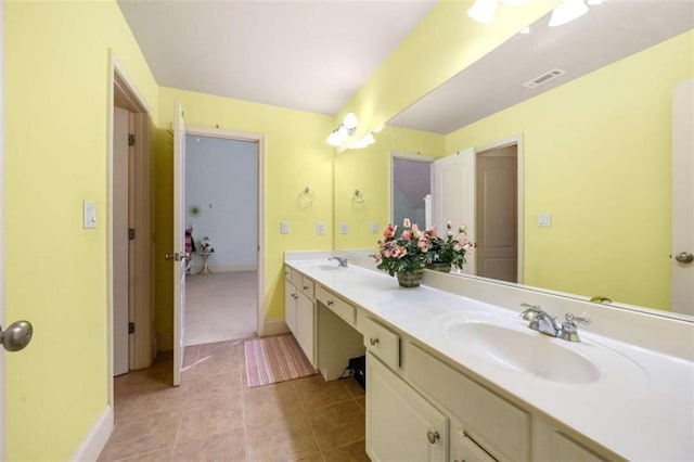 full bathroom featuring baseboards, tile patterned floors, a sink, visible vents, and double vanity